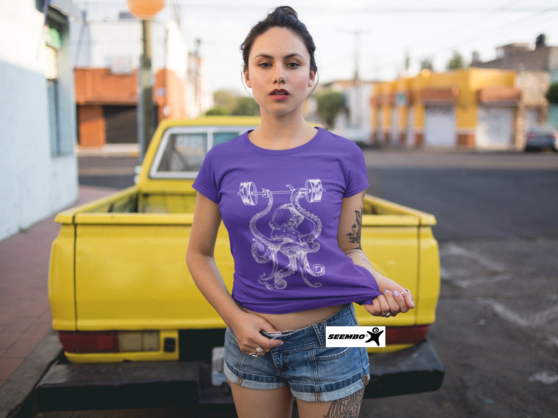 seembo-octopus-workout-barbells-fitness-purple-t-shirt-of-a-women-in-a-yellow-pick-up-truck-ipe204