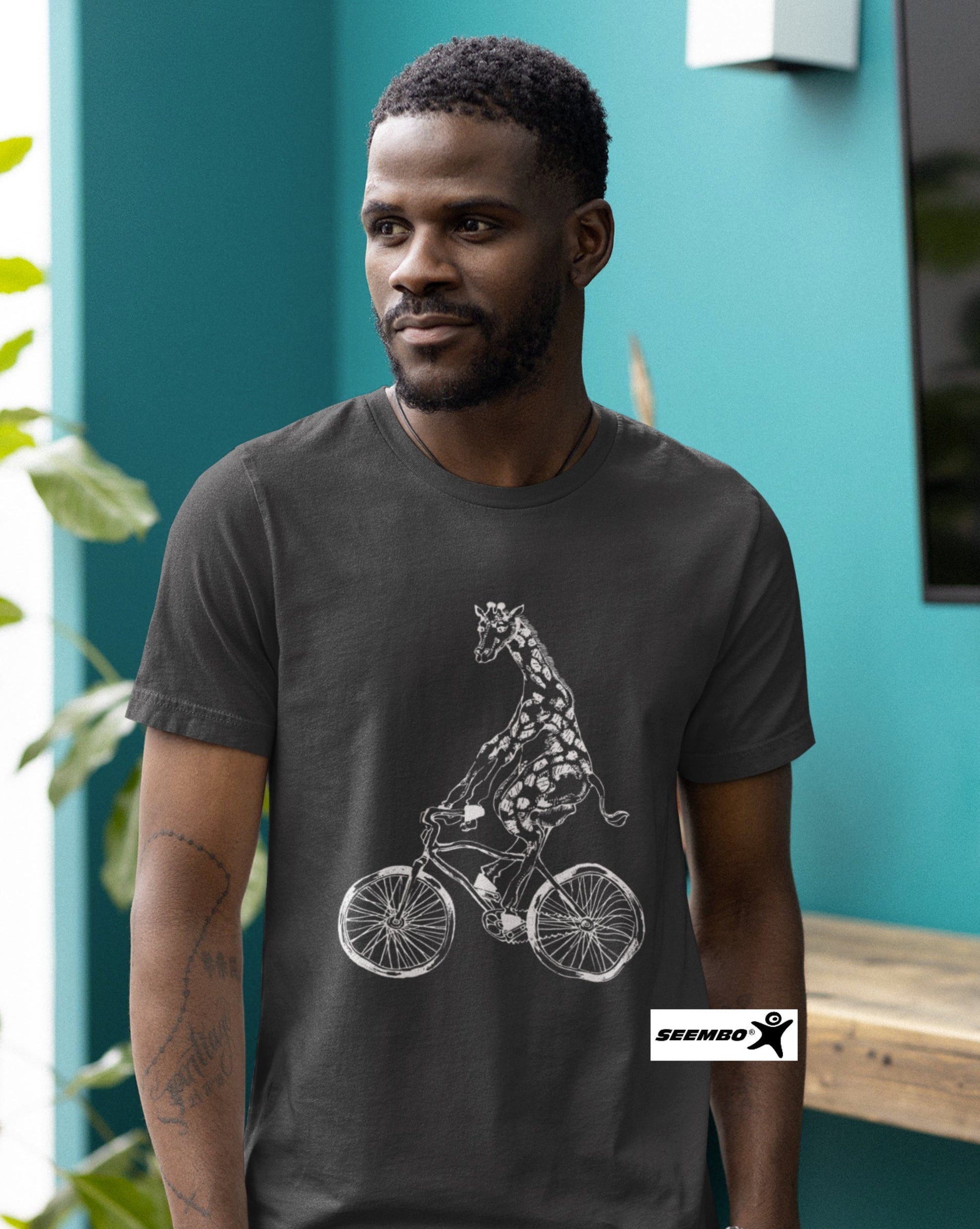a-man-wearing-asphalt-t-shirt-with-giraffe-cycling-bicycle-bike-design