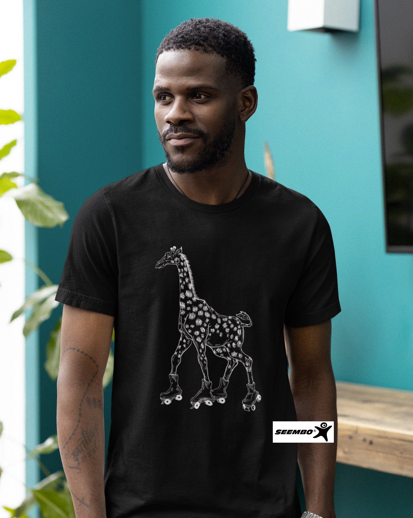 seembo-a-man-wearing-black-t-shirt-with-giraffe-skater-roller-skating-design