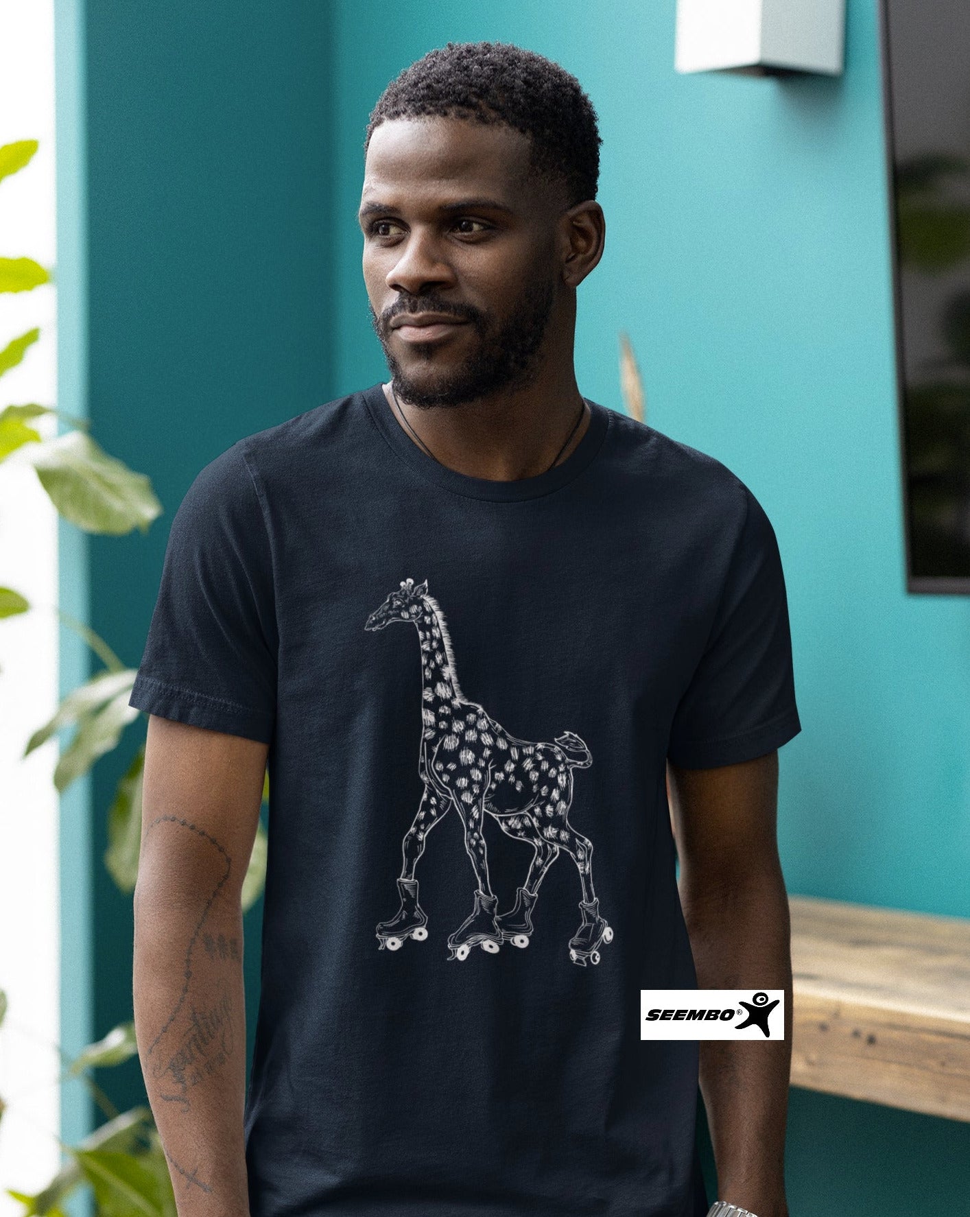 seembo-a-man-wearing-navy-t-shirt-with-giraffe-skater-roller-skating-design