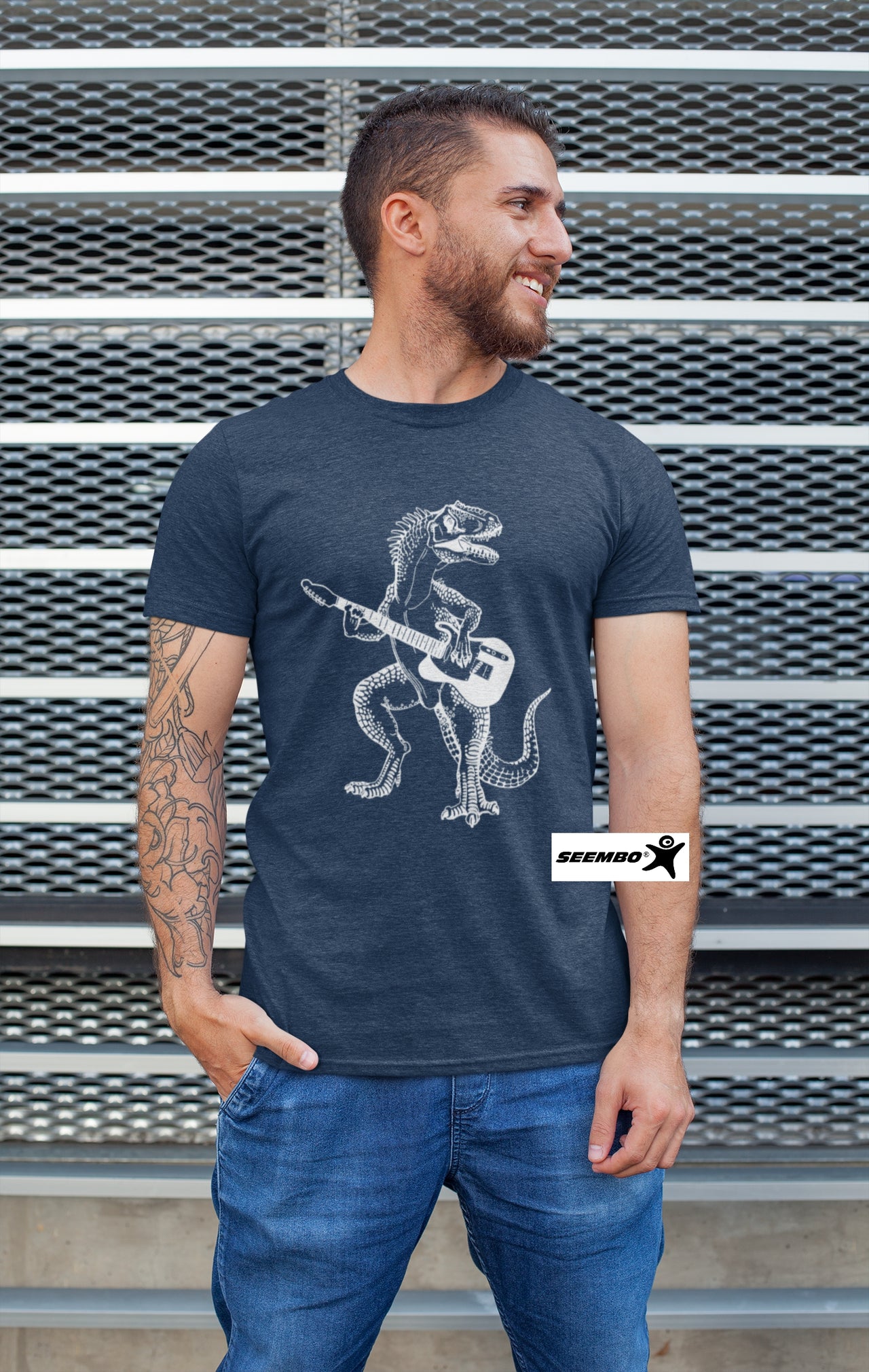 a-man-with-vintage-navy-t-shirt-and-dinosaur-playing-guitar-guitarist-art-on-it