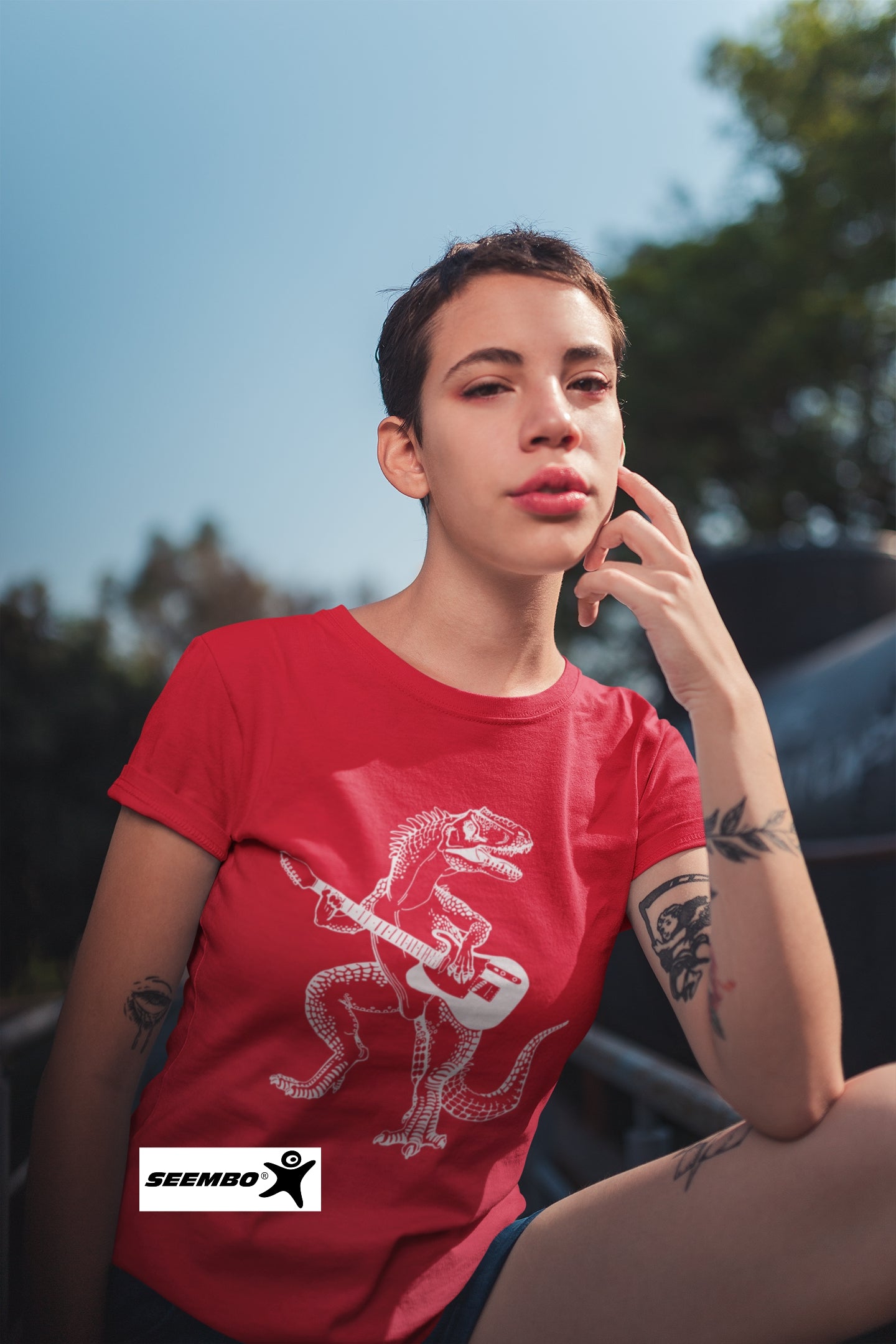 seembo-dinosaur-playing-guitar-red-t-shirt-of-a-woman-wearing-at-outside