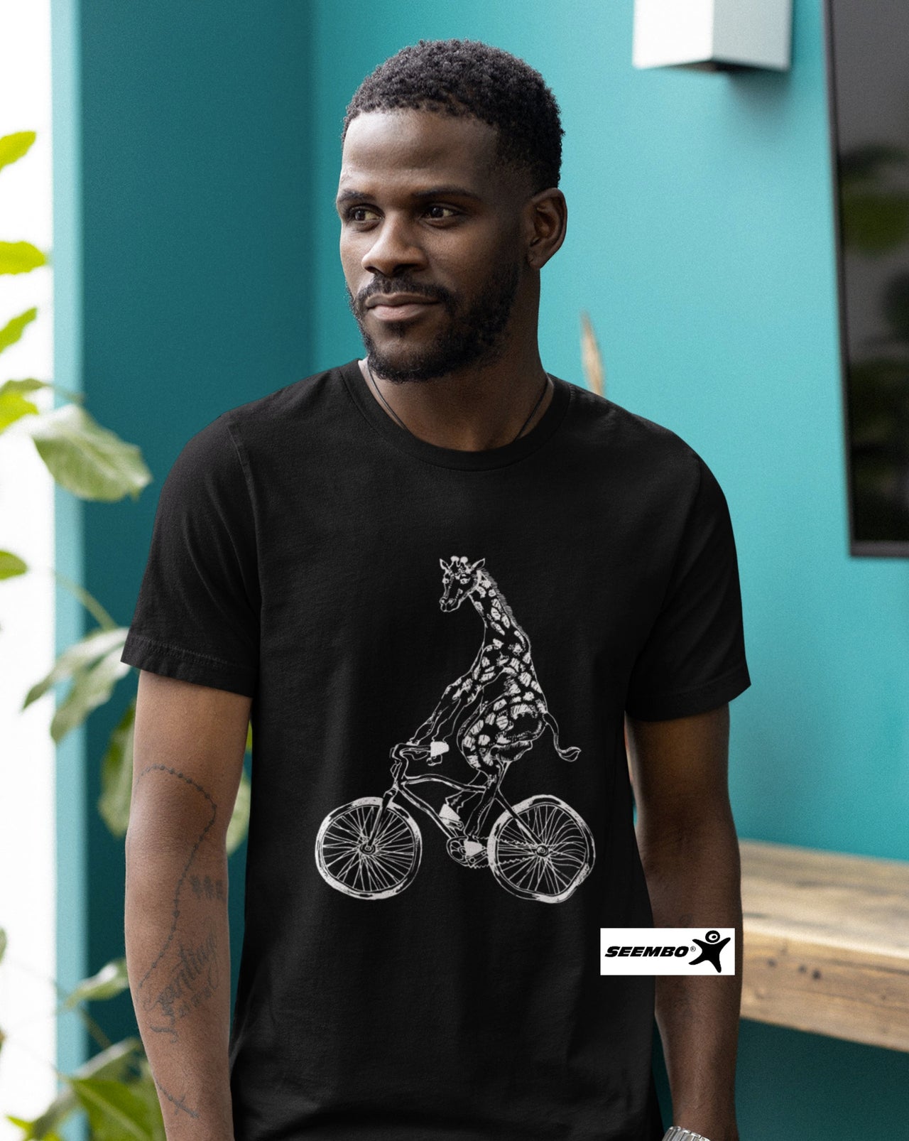 a-man-wearing-black-t-shirt-with-giraffe-cycling-bicycle-bike-design