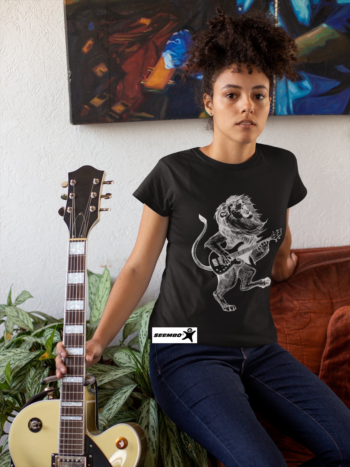 seembo-lion-playing-guitar-guitarist-black-t-shirt-of-a-woman-posing-with-her-guitar