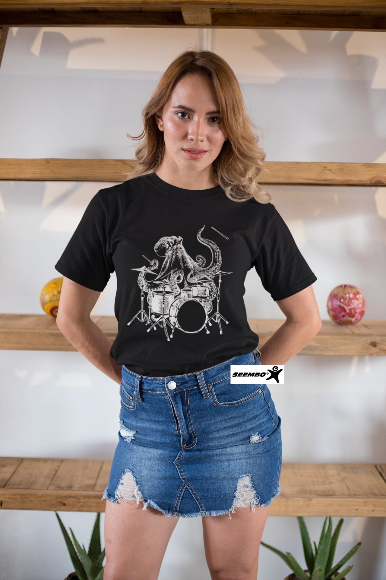seembo-octopus-playing-drums-black-t-shirt-of-a-woman-with-denim-skirt