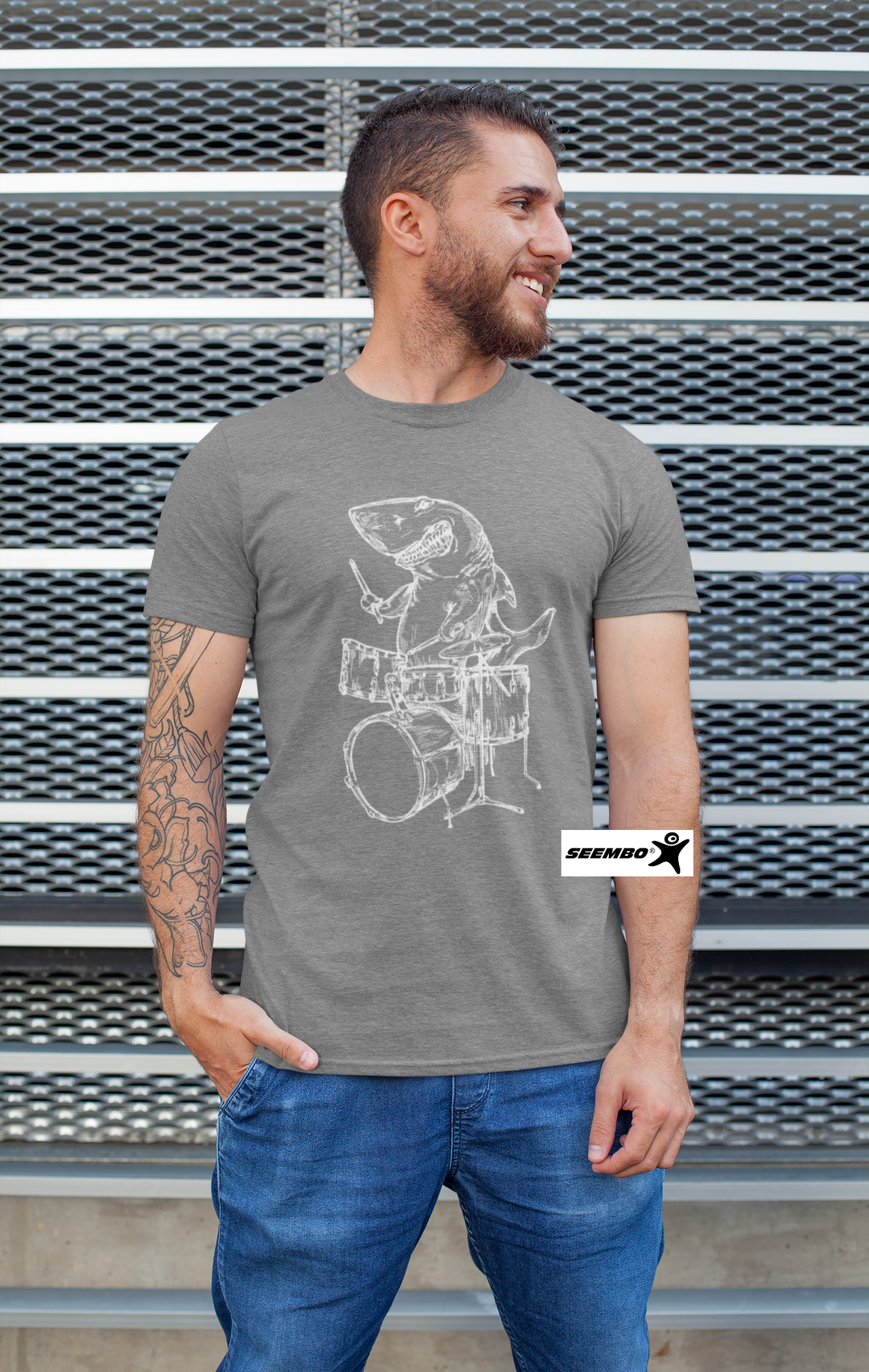 a-beared-man-wearing-a-vintage-grey-t-shirt-with-seembo-shark-playing-drums-drummer-musician-design